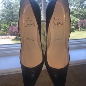 Christian Louboutin black leather pumps.
